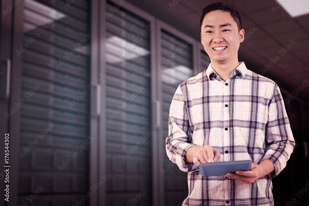 Composite image of happy man using tablet computer Composite image of happy man using tablet computer