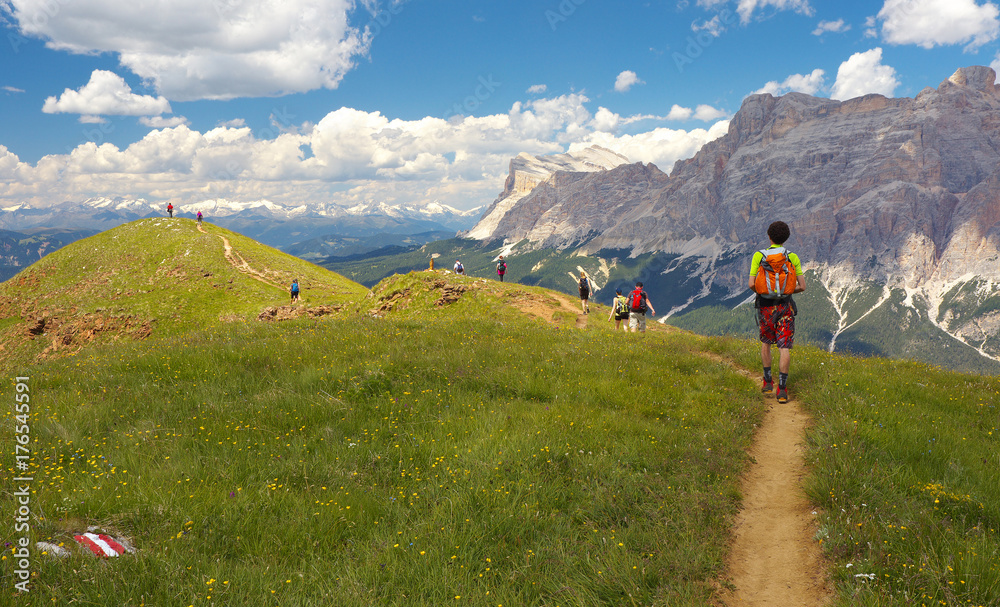 Group of walking tourists in the mountains, Dolomites, Italy Group of walking tourists in the mountains, Dolomites, Italy