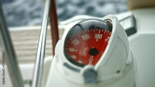 Sailboat compass close up photo