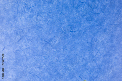 blue paper background with silk fibres