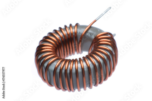 Close up inductor copper coils isolated on white background photo