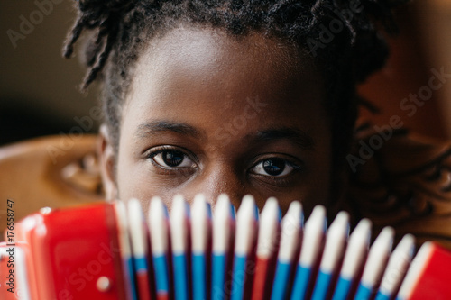 African American girl playing an accordion