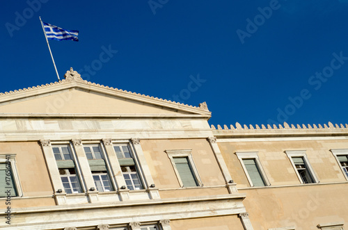 Greece flag on parliament building blue sky
