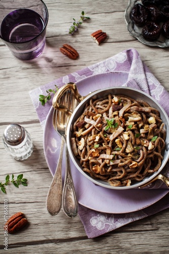 Homemade spaghetti with speck and mushrooms