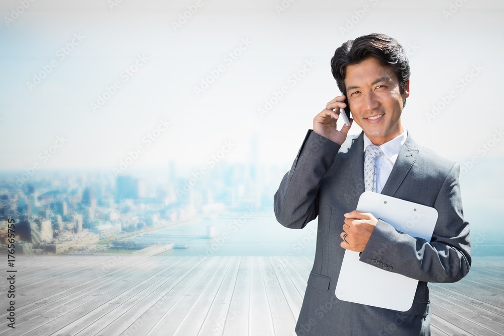 Composite image of confident estate agent standing at front door Composite image of confident estate agent standing at front door