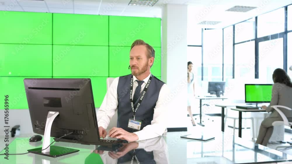 Phone operator with police service assisting a caller, with green background Phone operator with police service assisting a caller, with green background