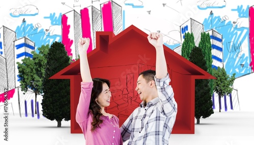 Composite image of cheerful young couple with hands raised photo