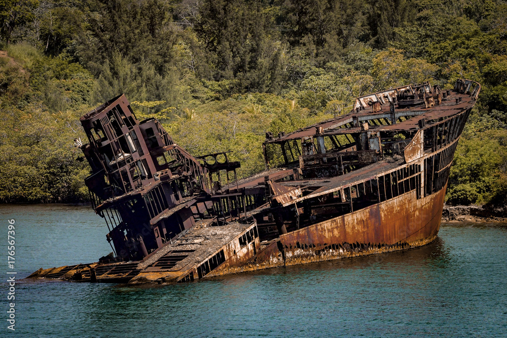 A sunken ship stranded on a beach is transformed into a rusty shipwreck after an accident