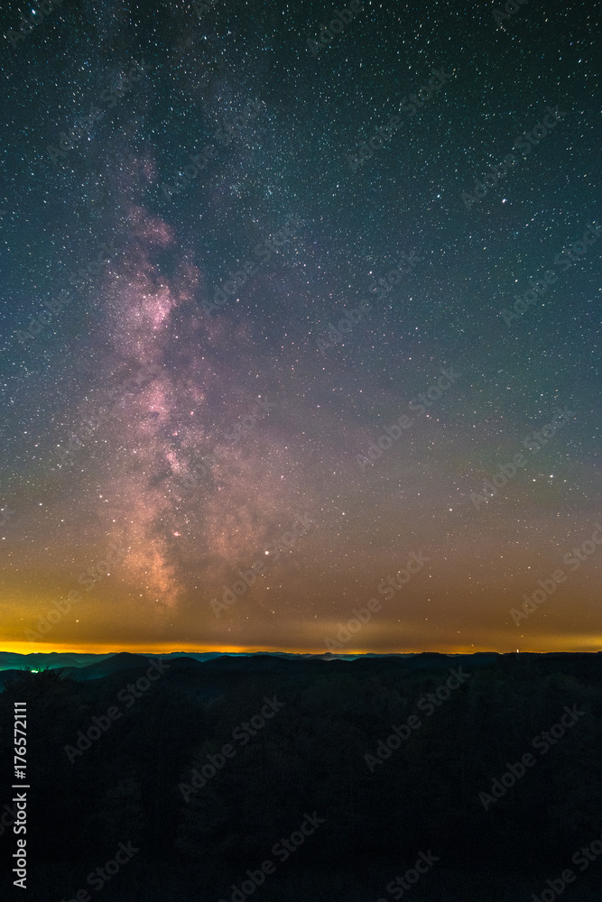 The center of the Milky Way as seen from the Schänzel Tower on the summit of the mountain Steigerkopf in the Palatinate Forest near Edenkoben in Germany.