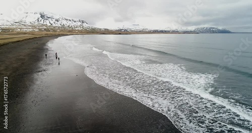 Aerial flight with drone over the black sandy beach of Brimilsvellir of Iceland. photo