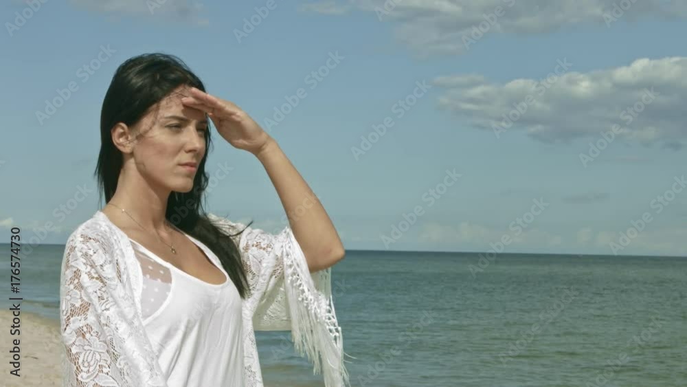 Woman looking at ocean view thinking about life Woman looking at ocean view thinking about life