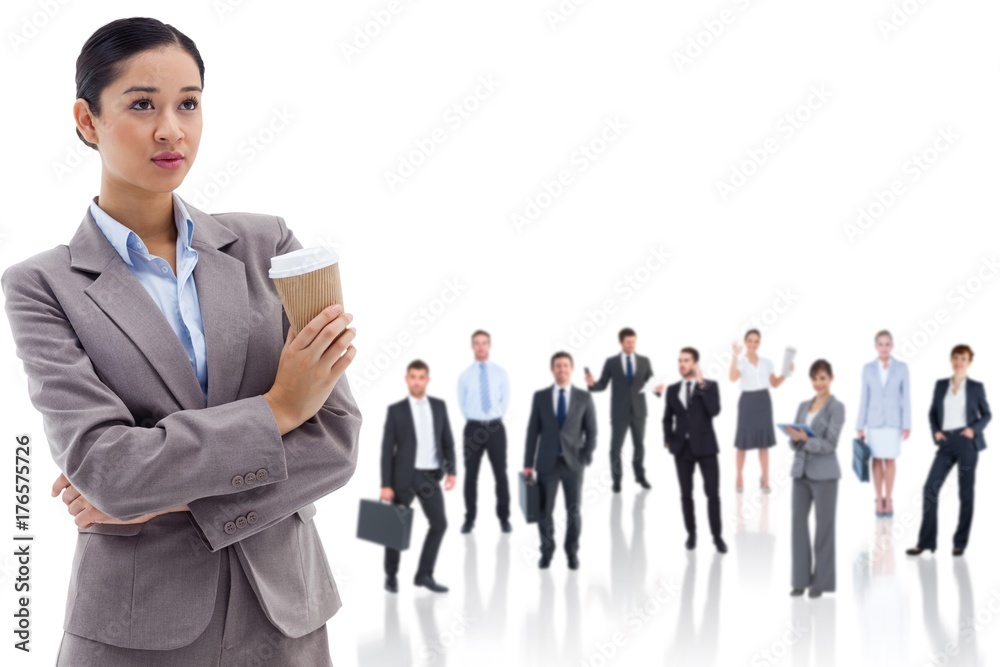Composite image of portrait of a cute businesswoman holding a Composite image of portrait of a cute businesswoman holding a