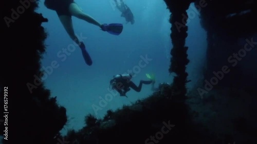 Scuba divers exploring the outside of the USS Spiegel Grove wreck, in the Florida Keys.  photo