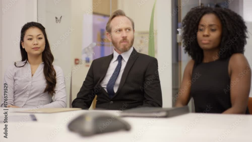 Business marketing team discussing technology gadget in a meeting Business marketing team discussing technology gadget in a meeting