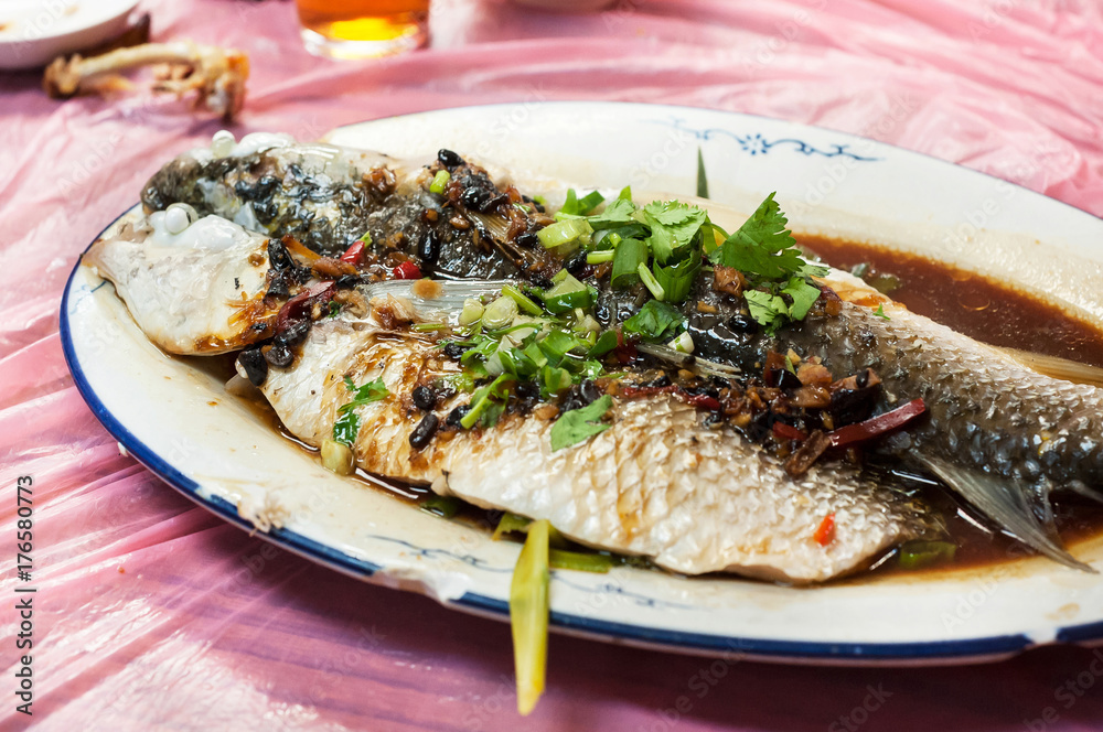 Steamed fish in black bean and soy sauce at Hong Kong restaurant Steamed fish in black bean and soy sauce at Hong Kong restaurant