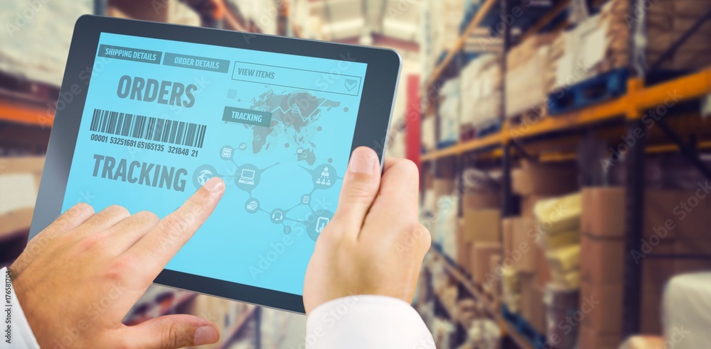 Composite image of man using tablet pc Composite image of man using tablet pc