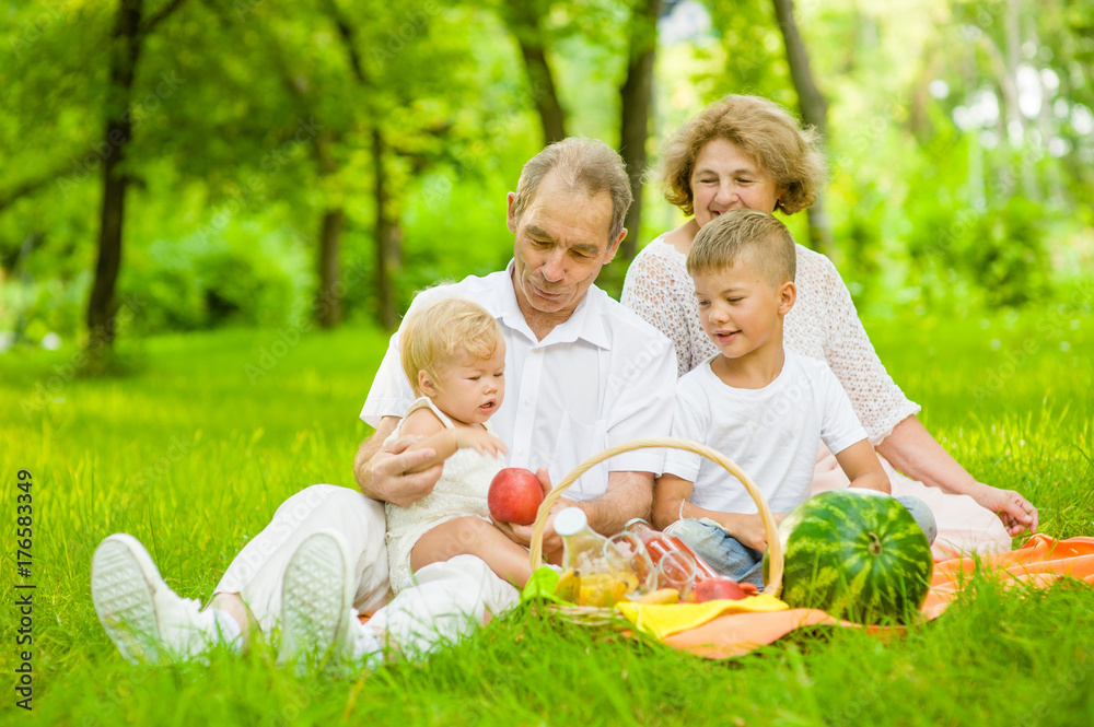 Grandparents have fun with grandchildren in nature Grandparents have fun with grandchildren in nature