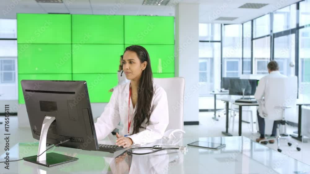 Healthcare worker assisting a patient over the phone, with green background Healthcare worker assisting a patient over the phone, with green background