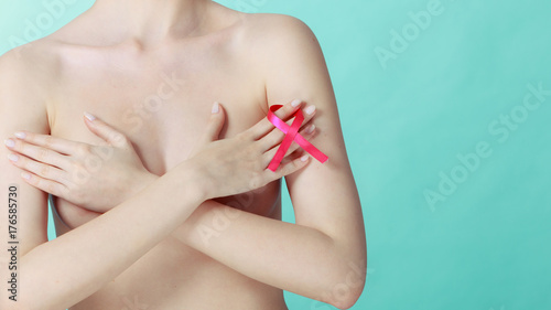 Naked woman with breast cancer awareness ribbon