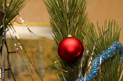 New Year's toys on Christmas tree for Christmas photo