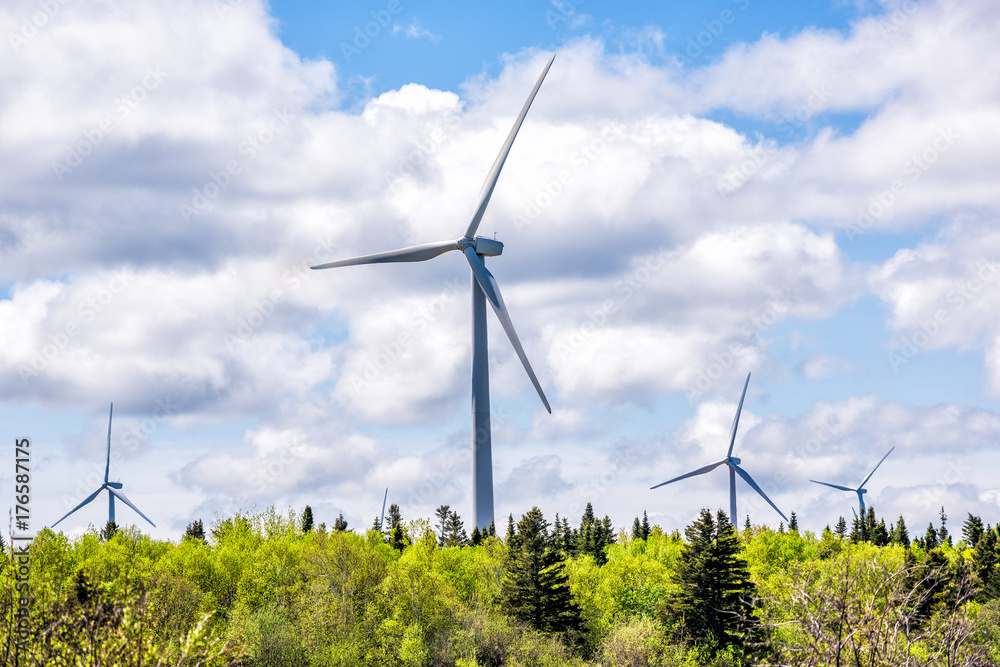 Fototapeta premium Closeup of large, huge wind turbines on Gaspesie coast in Quebec, Canada in Capucins