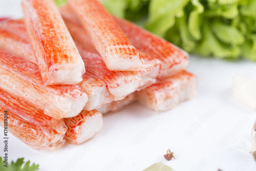 Closeup of crab stick with green lettuce and coriander, pepper and other spices. Closeup of crab stick with green lettuce and coriander, pepper and other spices.