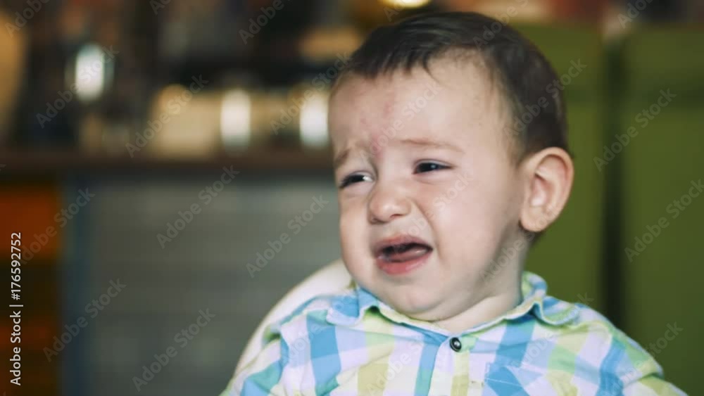 The child protests, refuses to eat, smiles in every possible way and tries to make his mother laugh, no matter what. 4k. The child protests, refuses to eat, smiles in every possible way and tries to make his mother laugh, no matter what. 4k.