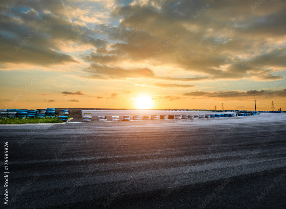 Asphalt road circuit and sky sunset with car tire brake