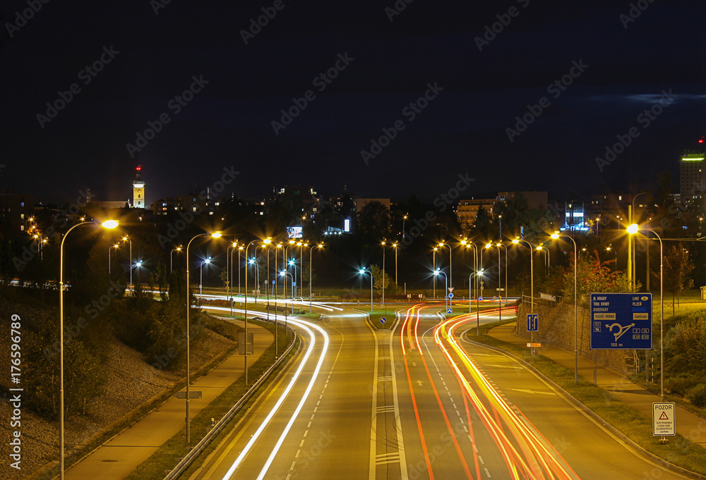 Street and car at night on long exposure with Ceske Budejovice in background