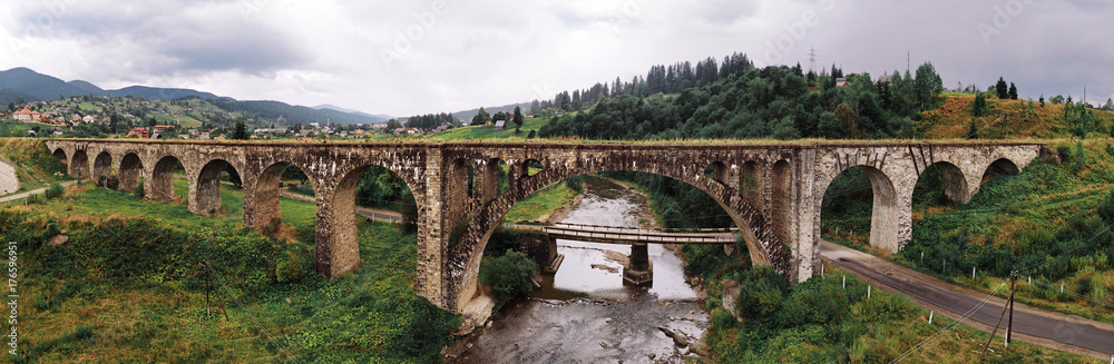Panorama of the old austrian bridge through the river at the Karpatian mountains view from left middle side near river