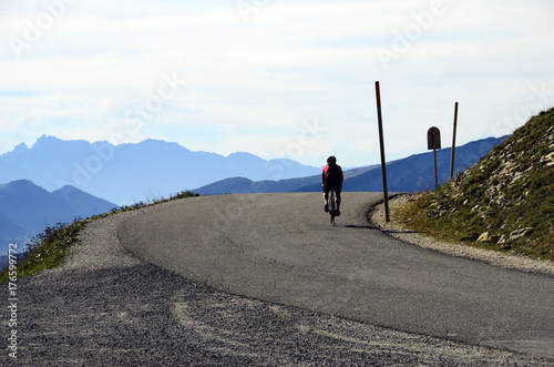 Cyclist arriving at Semnoz summit, Savoy, France photo