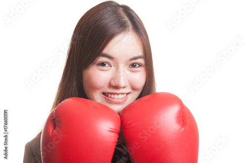 Young Asian business woman with red boxing gloves. © halfbottle