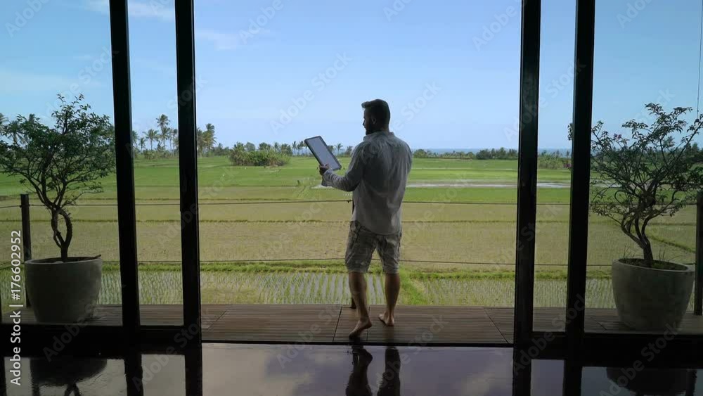 Man going on the terrace while having a videocall on tablet, steadycam shot
Man going on the terrace while having a videocall on tablet, steadycam shot