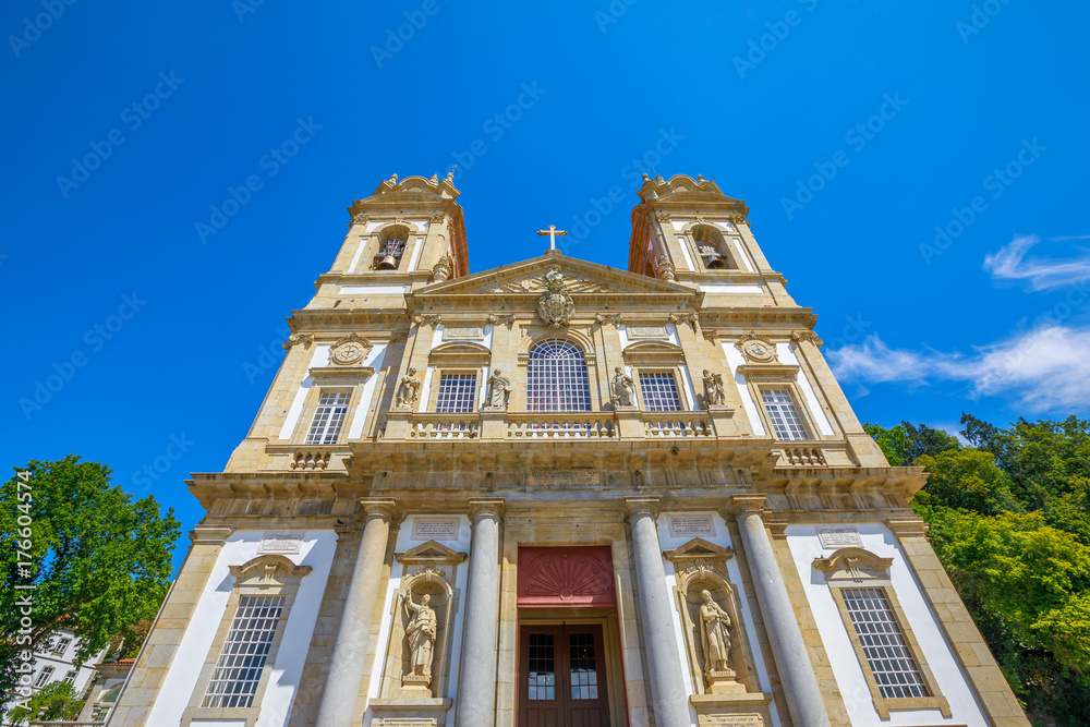 Facade of the Bom Jesus do Monte Sanctuary in neoclassical style in a sunny day. Tenoes near Braga, north of Portugal, Europe. Perspective view from down to up