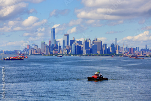 Tugboat in Harbor with New York City in Background