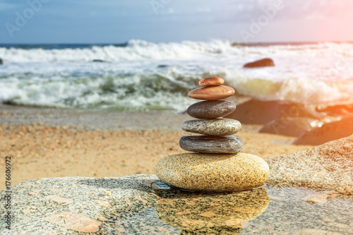 Zen Balancing Pebbles on Beach