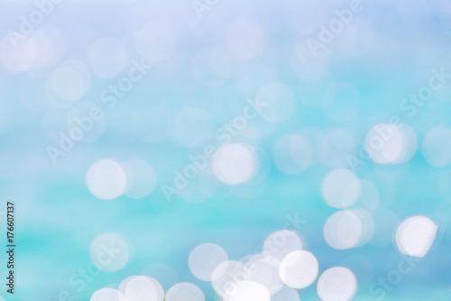 Defocused of blue water surface with waves glittering in the sun