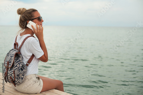 Young woman talking on smartphone