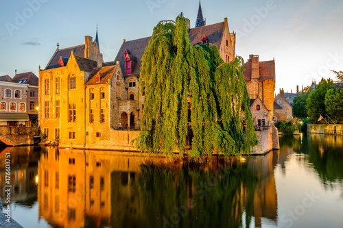 Bruges (Brugge) cityscape with water canal at sunset