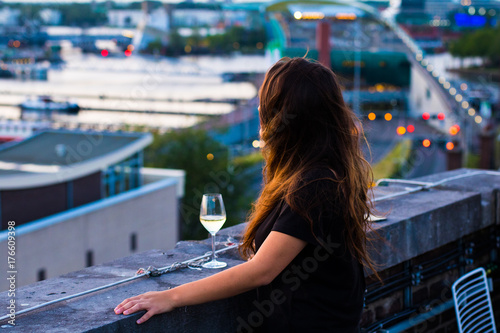 Photography Smoking Woman watching sunset of Amsterdam from rooftop terrace