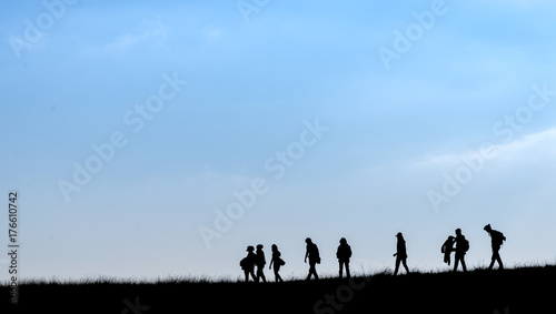 Silhouette of human scale hike and trail on mountain