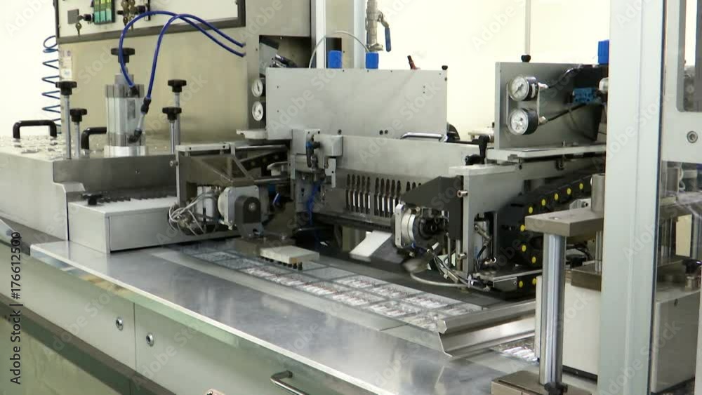 robotic packaging of medical ampules on the industrial line robotic packaging of medical ampules on the industrial line