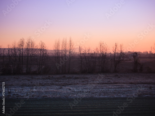 Winter sunrise over the ice-cold countryside.