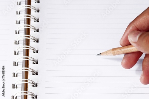 Wooden pencil in blur man's hands