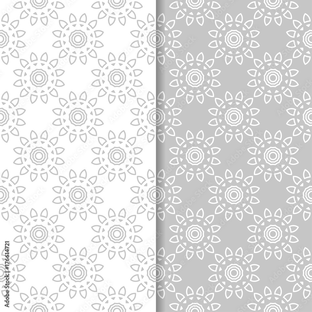 Floral seamless patterns. Set of light gray vertical wallpaper backgrounds Floral seamless patterns. Set of light gray vertical wallpaper backgrounds