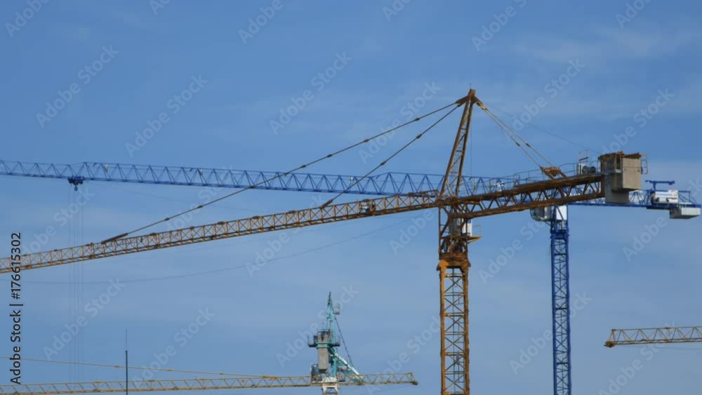 4k video of Crane moving construction panel with blue sky 4k video of Crane moving construction panel with blue sky