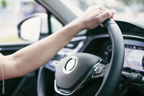 Woman driving a car, hand image detail