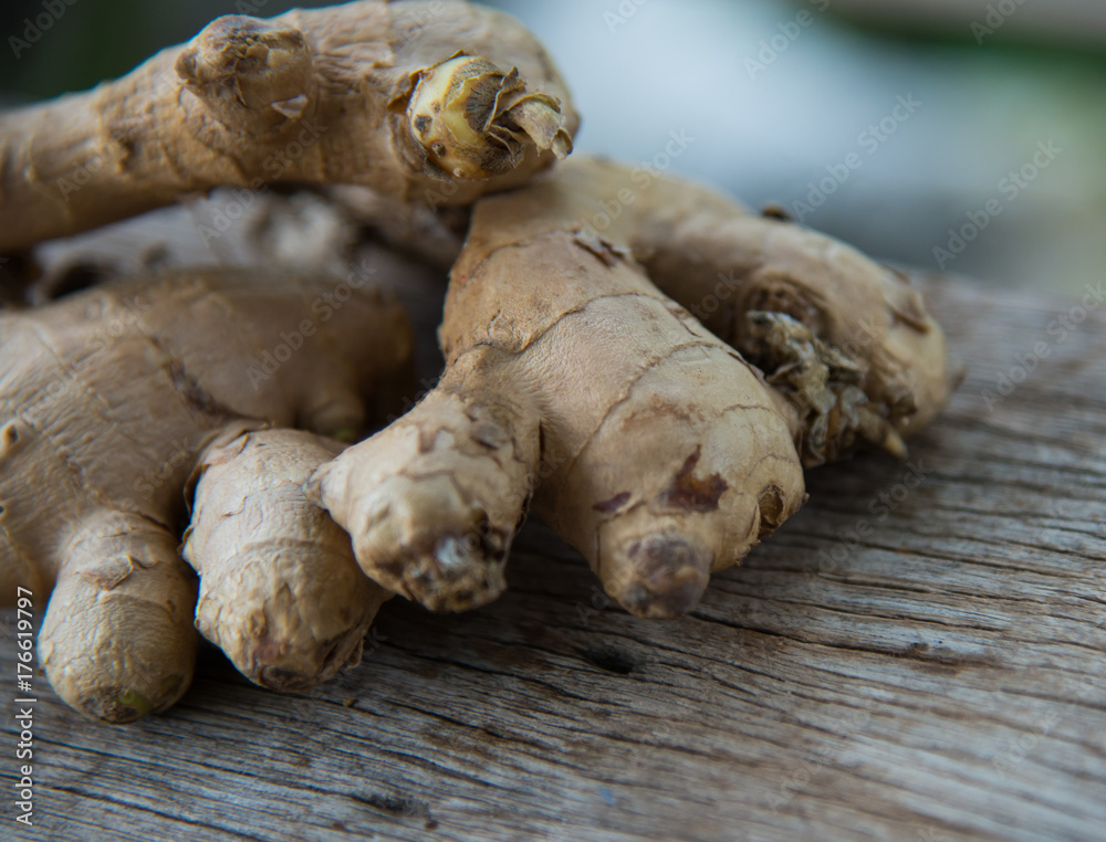 Fresh ginger on wood texture. Fresh ginger on wood texture.