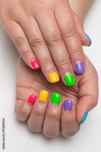 festive blue, purple, light green, green, yellow, pink manicure on short square nails