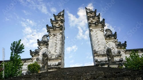 Steps leading to the split gateway of the temple PuraLuhur Lempuyang, Bali, Indonesia. The split gateway is the traditional balinese entrance to the temple which is named candi bentar. Timelapse. photo